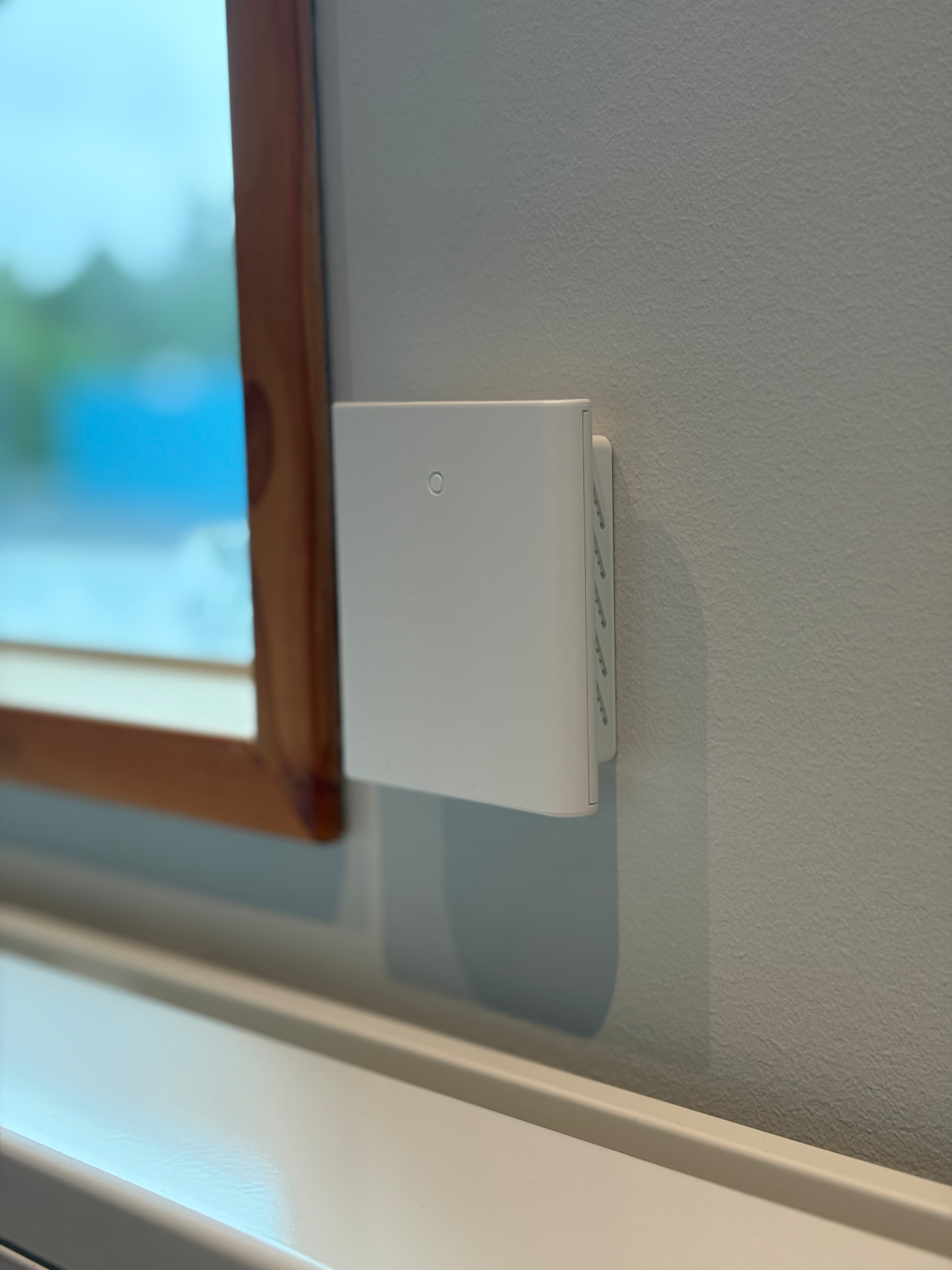 S-2Connect® Pro1 device mounted on an interior wall next to a window